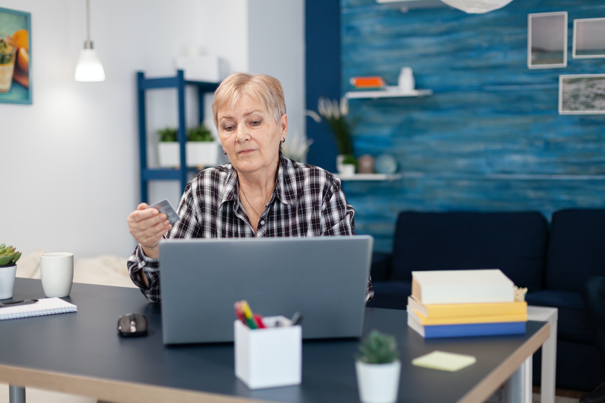 Senior woman learning to do bank operation